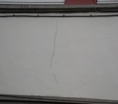 Cracked render on wall repaired by P & AS Hayselden Decorators Barnsley